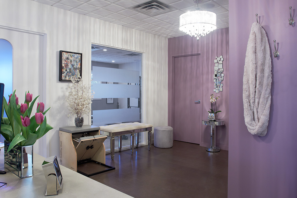 A room with purple walls and white trim.